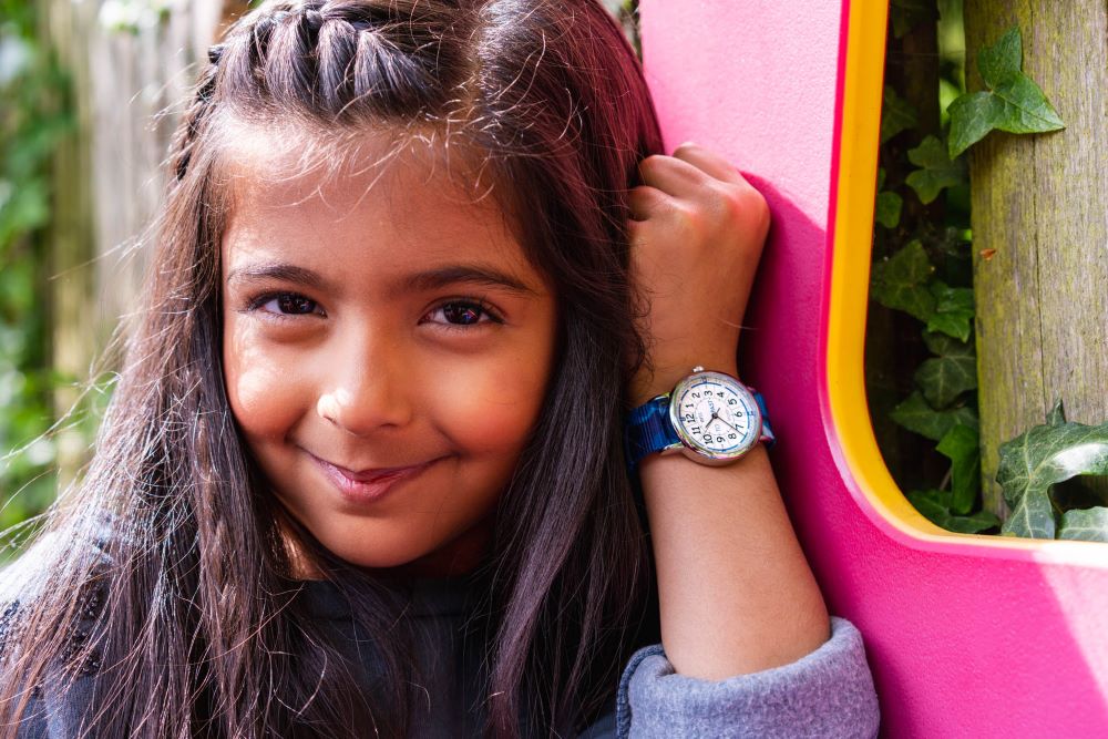 white face time teaching watch with blue camouflage strap